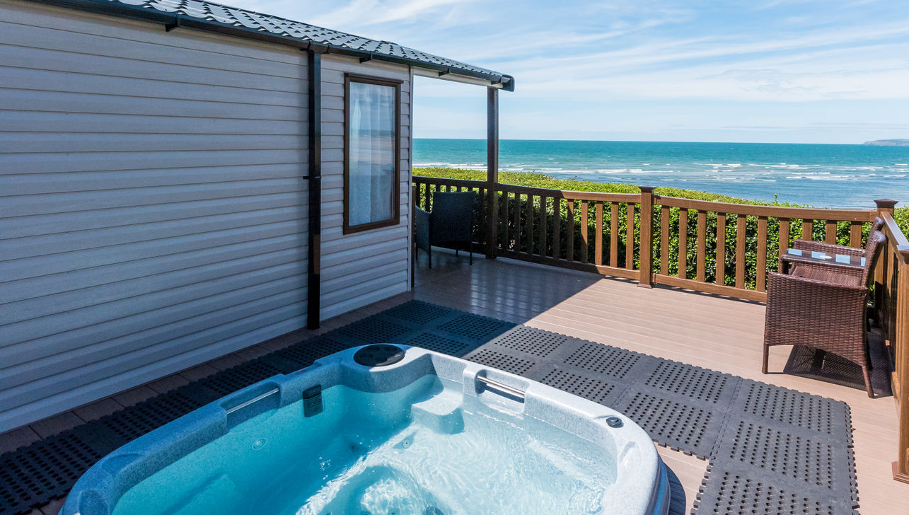 A View of the Sea from the decking area with a Hot Tub