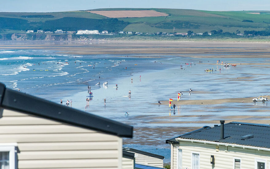 Views of Westward Ho! beach through caravans