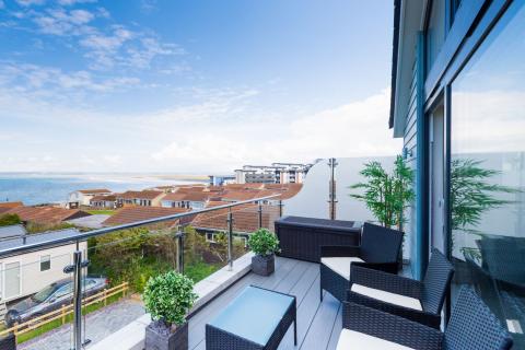 View from an Apartment Outside Decking Looking out over other Accommodation and the Sea