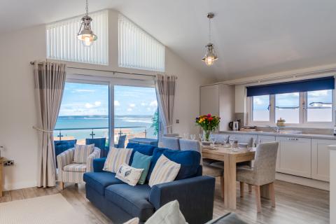 Lounge and Dining Area with Sea Views of an Apartment