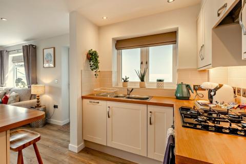Kitchen & Breakfast Bar Area of Waters Edge 2 Bedroom Apartment