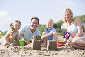 Family sitting on beach
