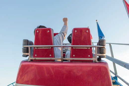 People enjoying a day out on a rollacoaster