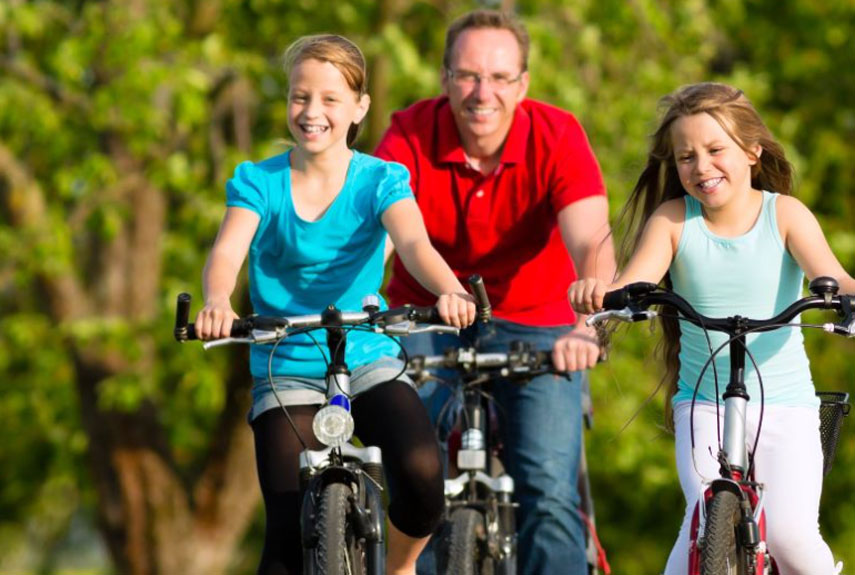 Three People Riding Bikes Hired from Torrington Cycle Hire