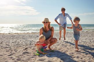 Family of four on beach