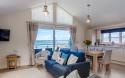Lounge and Dining Area with Sea Views of an Apartment